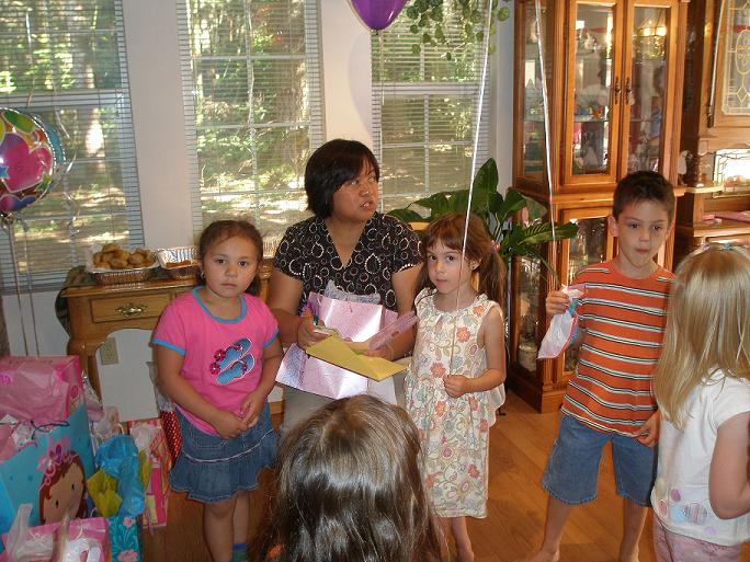 with mom opening lots of presents