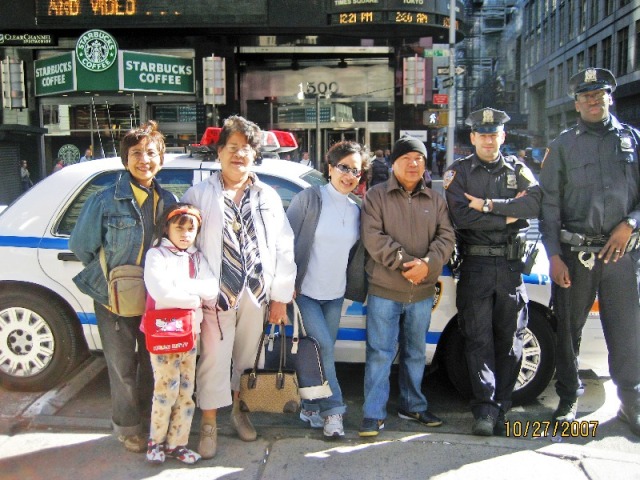 Detained by NYPD Cops charged with SMILING (joke only).  Haha!'Twas a good chance to pose with them..jpg